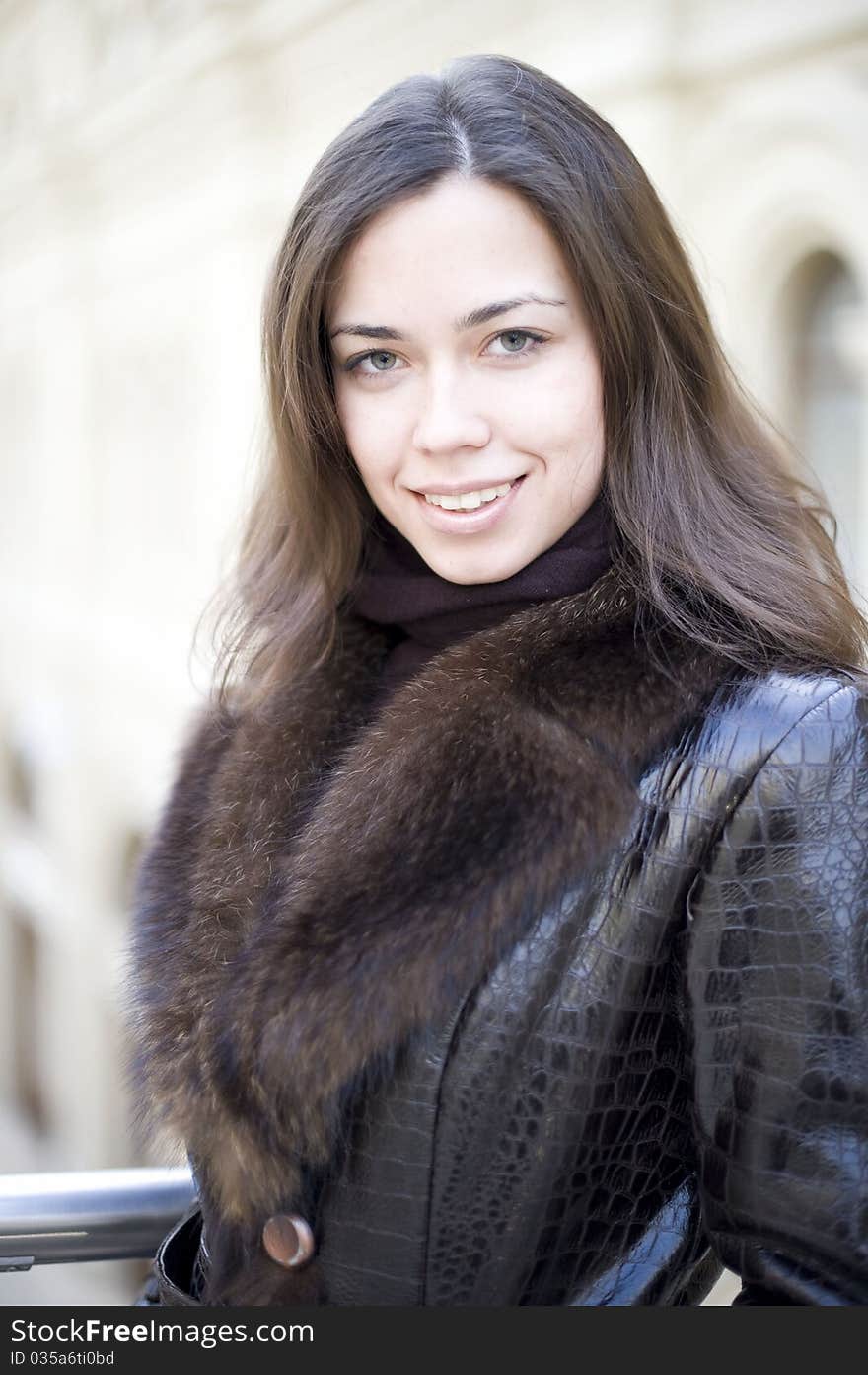 Young Girl In A Fur Coat With Her Hair