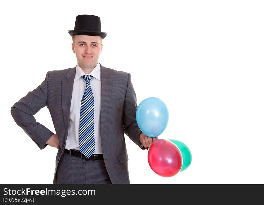 Businessman in a black hat with inflatable colored balls