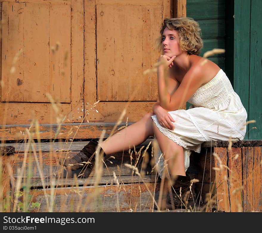 Outdoor fashion portrait of a young woman. Outdoor fashion portrait of a young woman