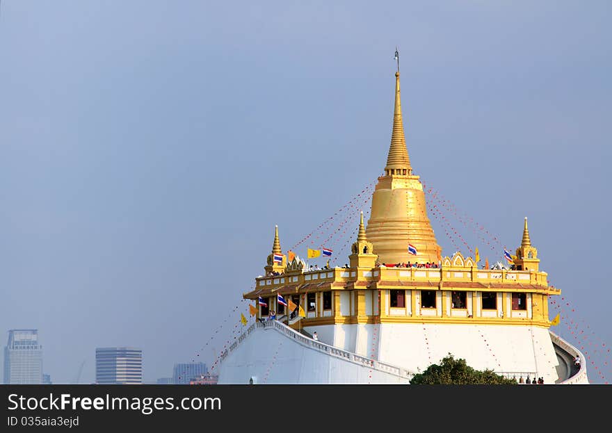 Ancient buddha temple in Bangkok nice bright blue sky background. Ancient buddha temple in Bangkok nice bright blue sky background