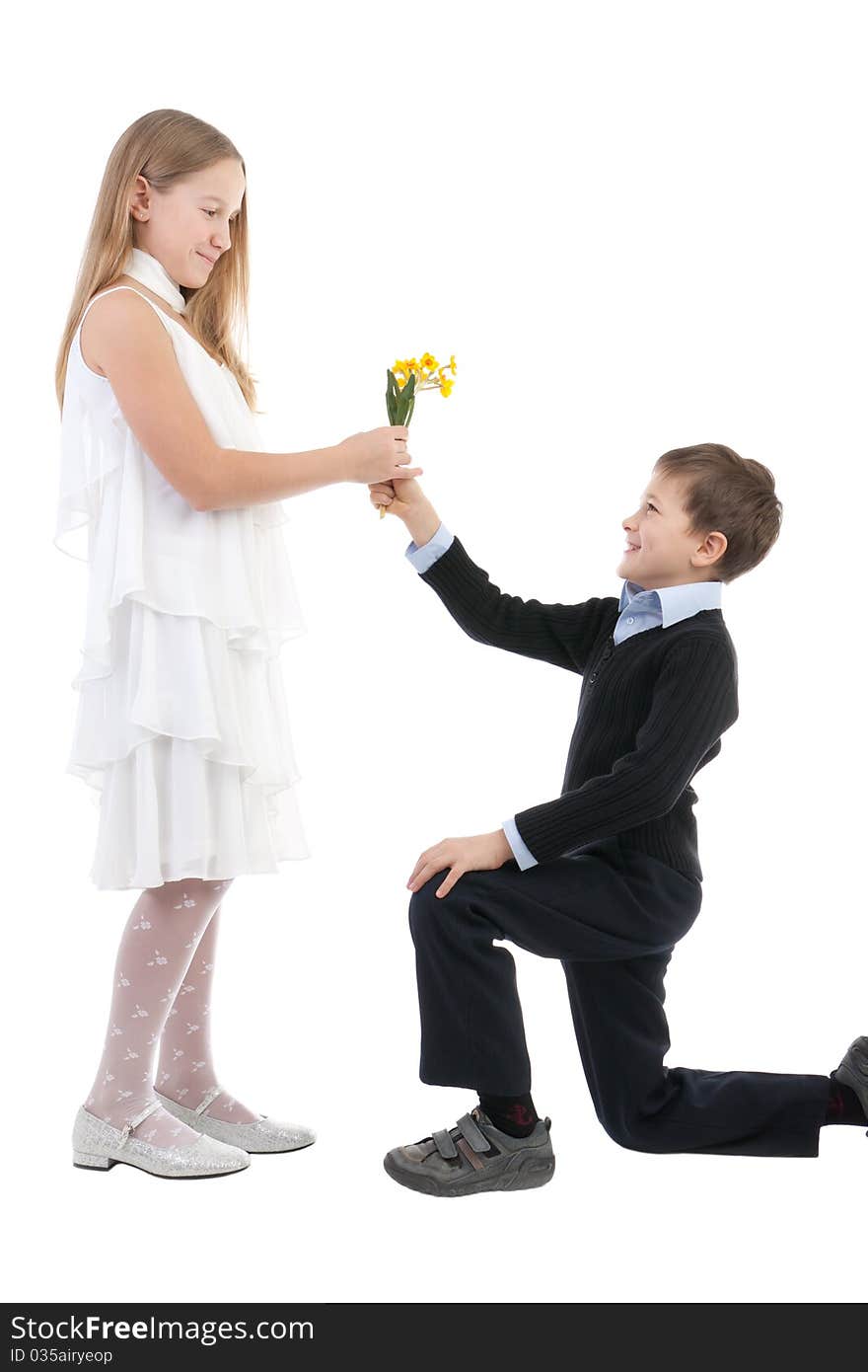 The boy gives to the girl flowers
 on a white background