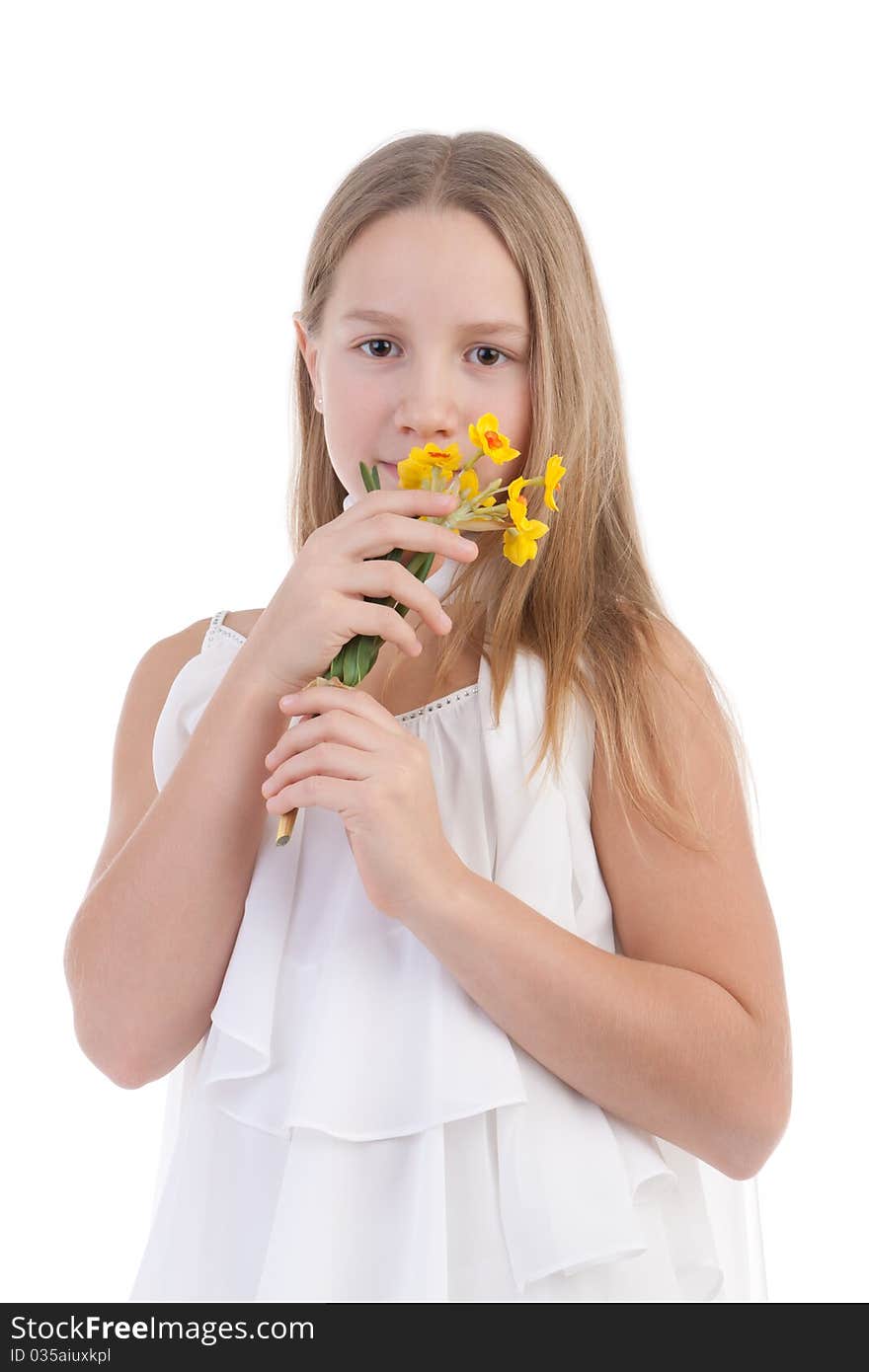 The girl smells flowers