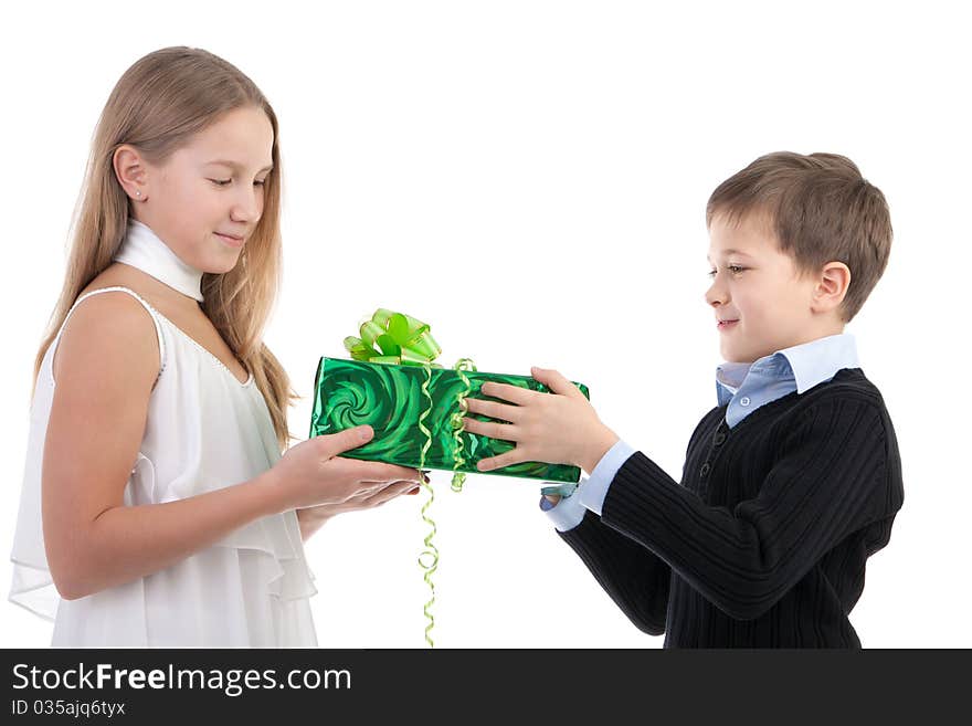 The boy gives to the girl a gift on a white background