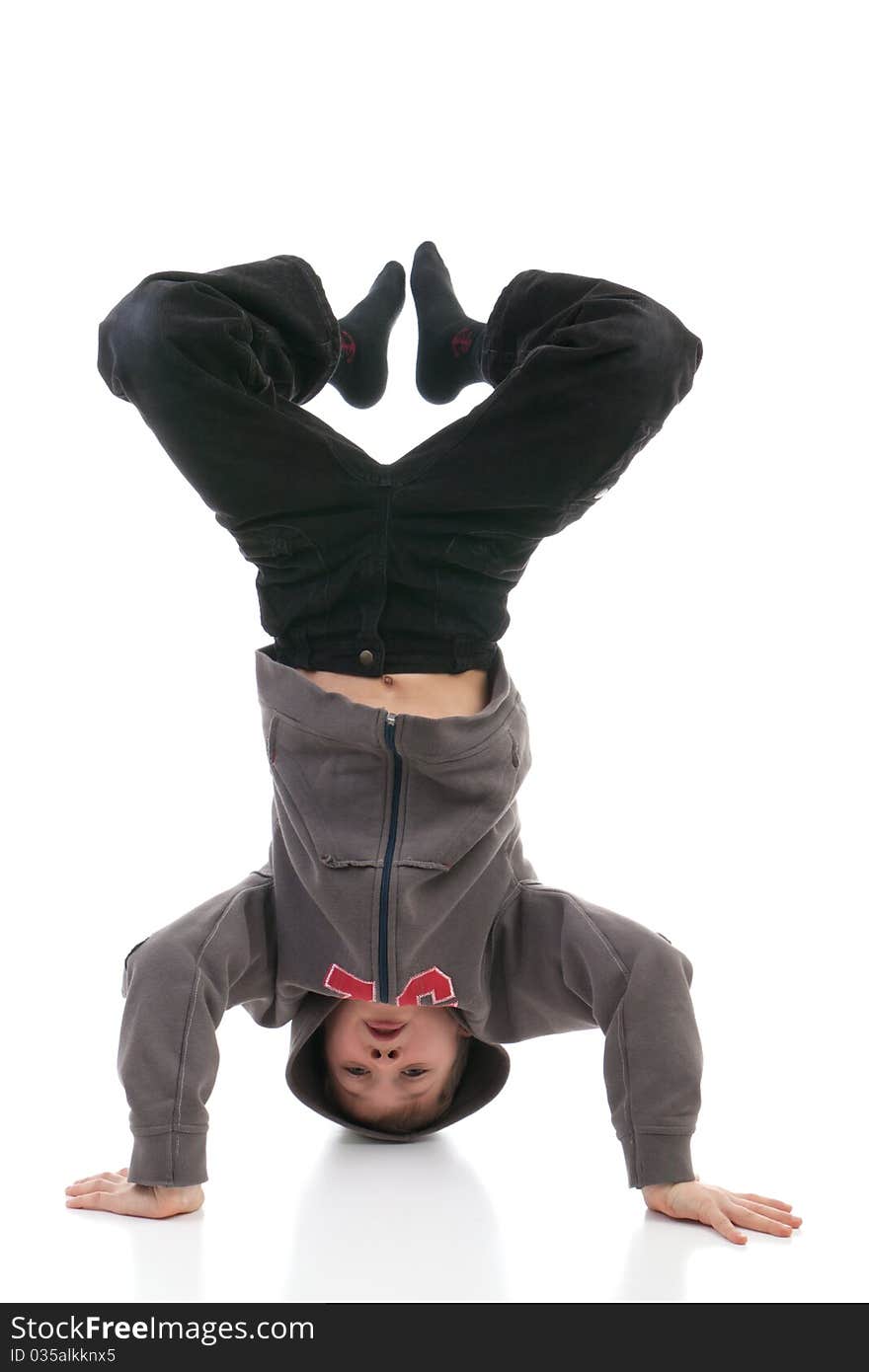 The boy stands on a head on a white background