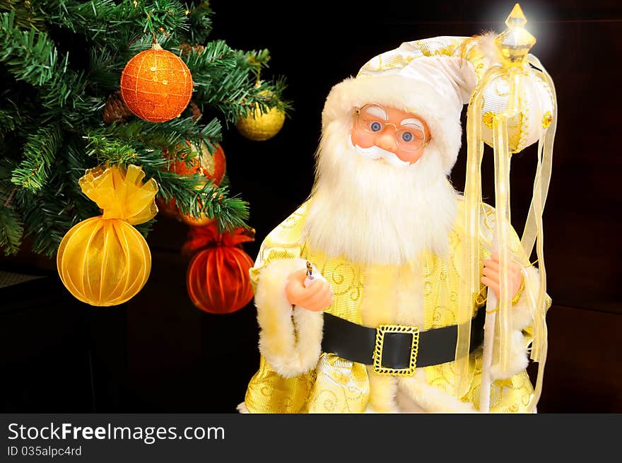 Golden Santa Claus with candy