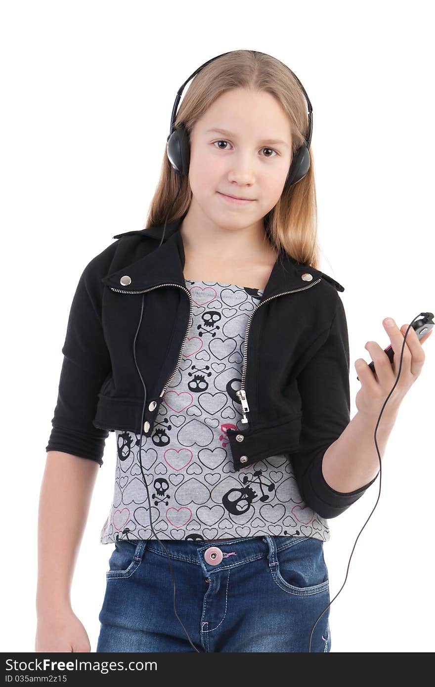 The girl in ear-phones listens to music. The girl in ear-phones listens to music