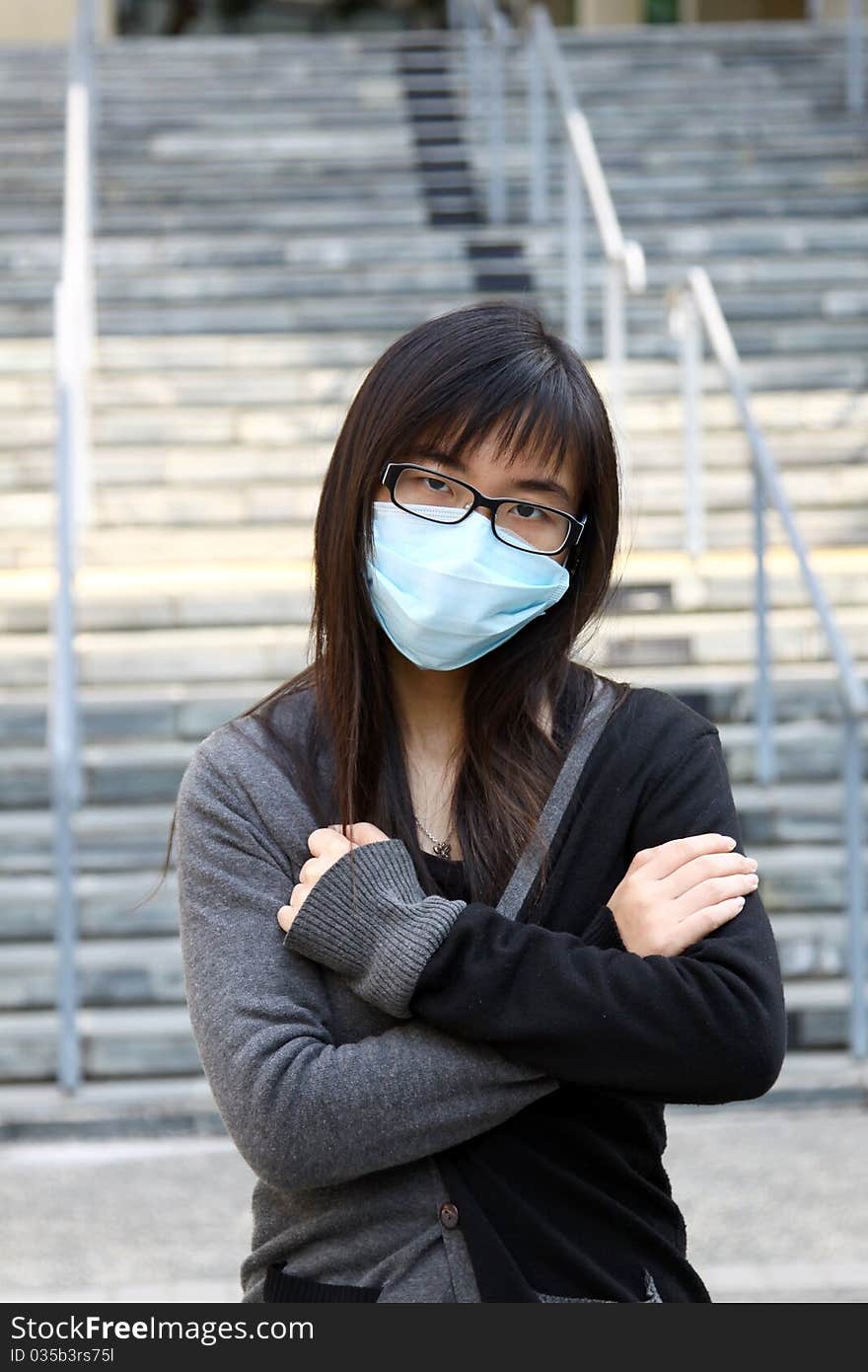 Asian Girl Who Is Sick And Wearing Mask