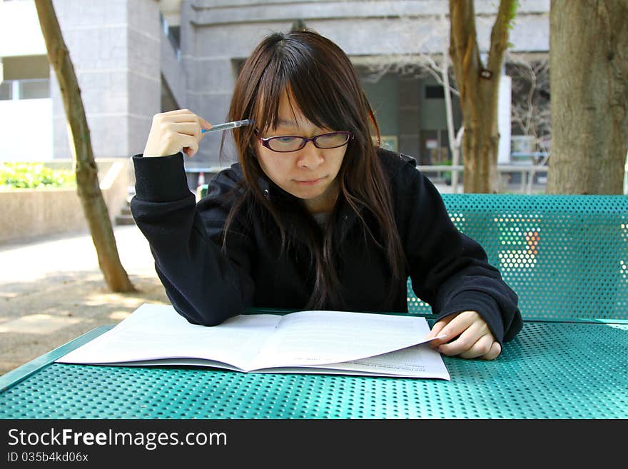 Chinese girl who is reading books