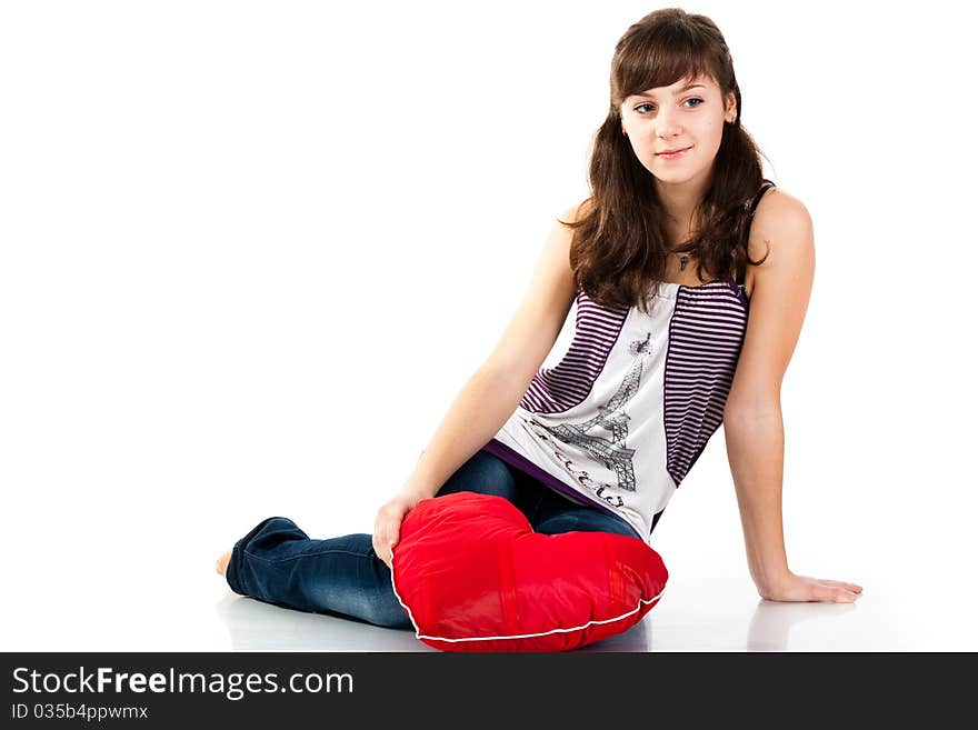 Beautiful girl sitting with heart