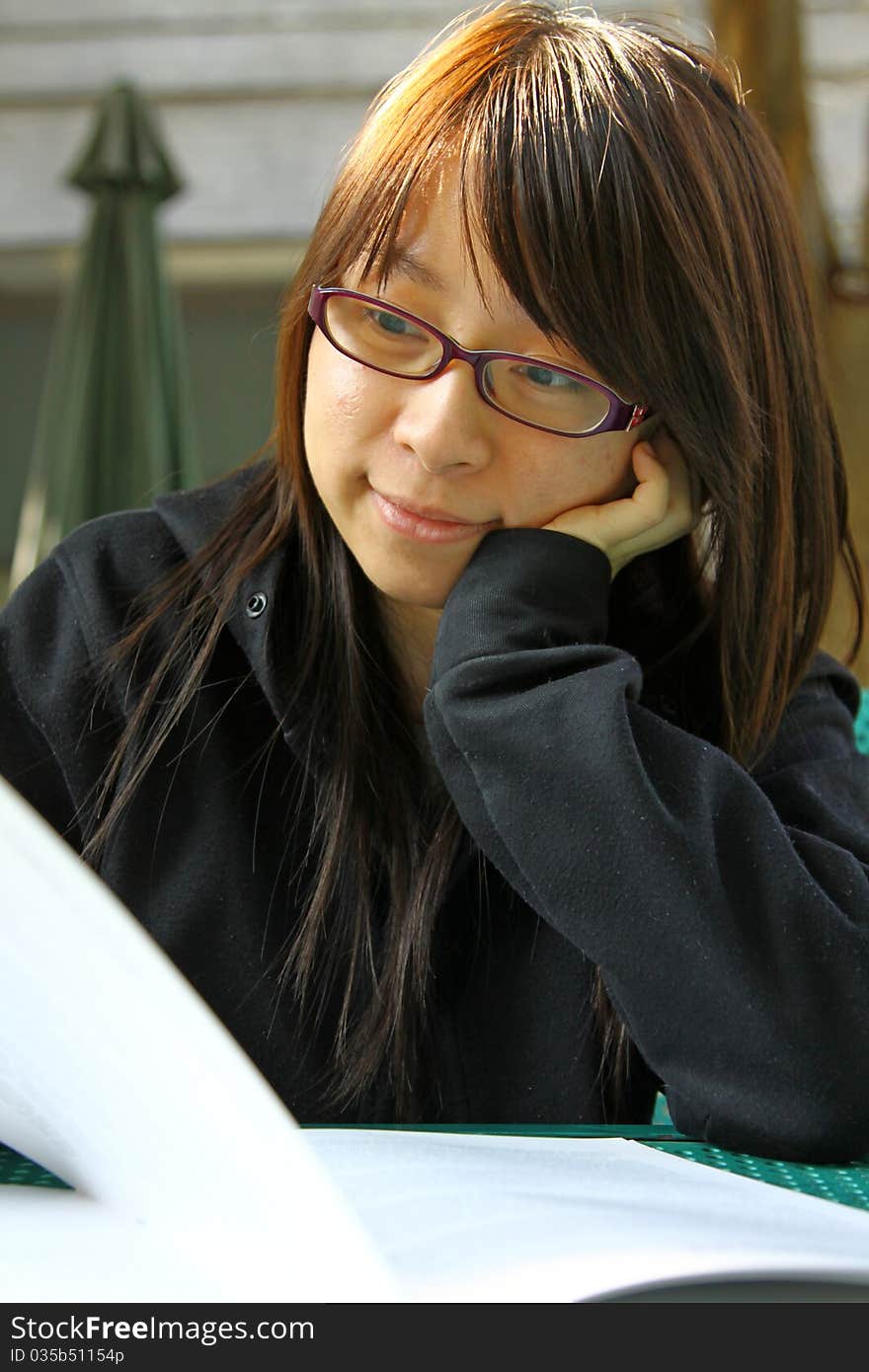 Chinese Girl Who Is Reading Books