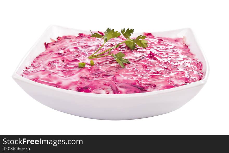 Herring mayonnaise. Delicious, fresh salad on a plate isolated on white background