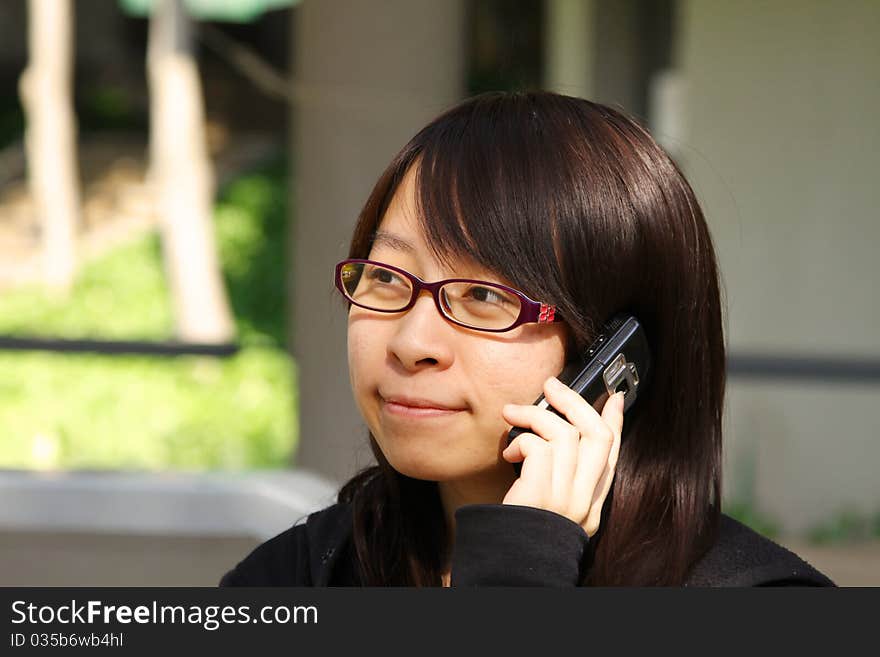 Chinese girl who is talking in phone