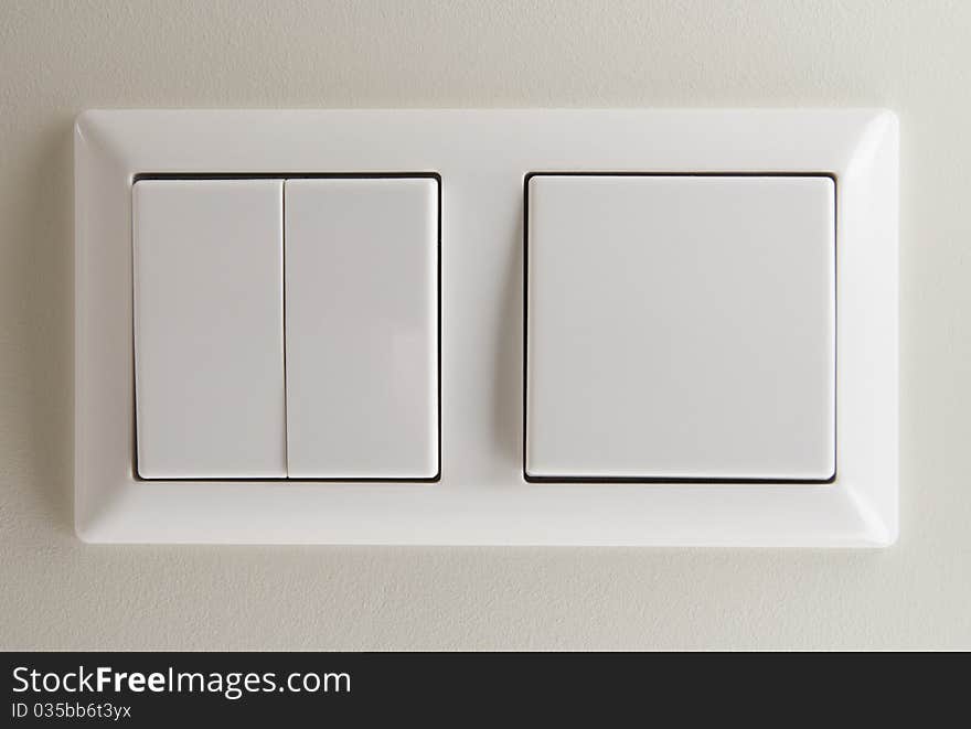 Two light switches on wall