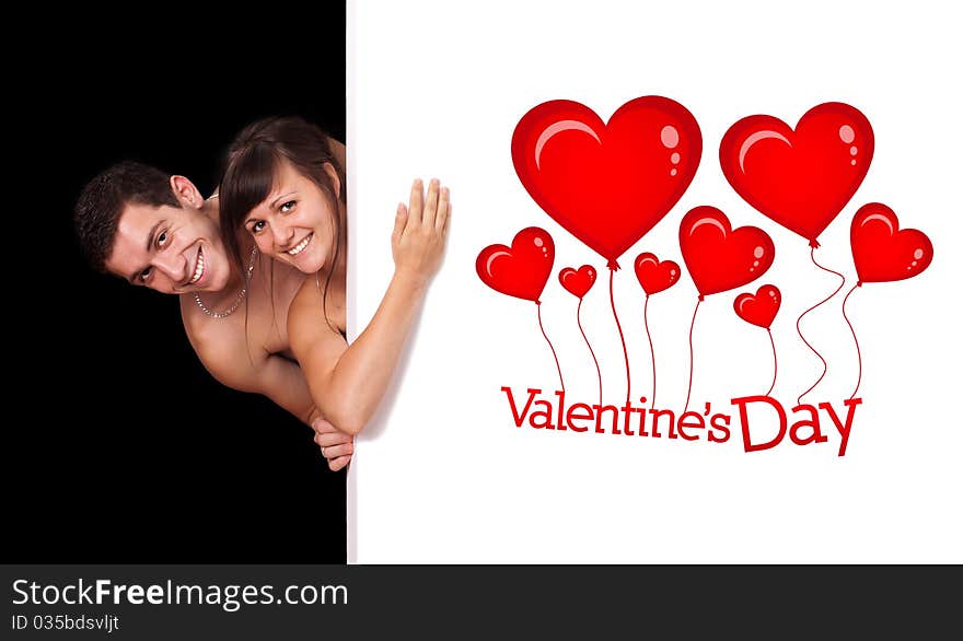 A cute couple behind a white wall, valentine's day theme