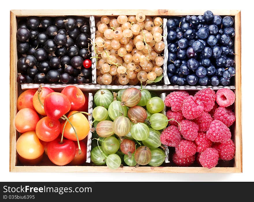 Different colourful berries in the box. Different colourful berries in the box.