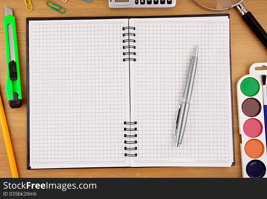 School Accessories And Notebook On Table