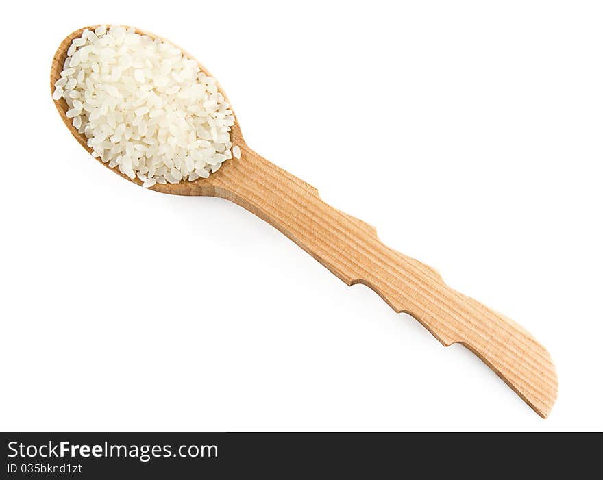 Rice grain in wooden spoon isolated on white background