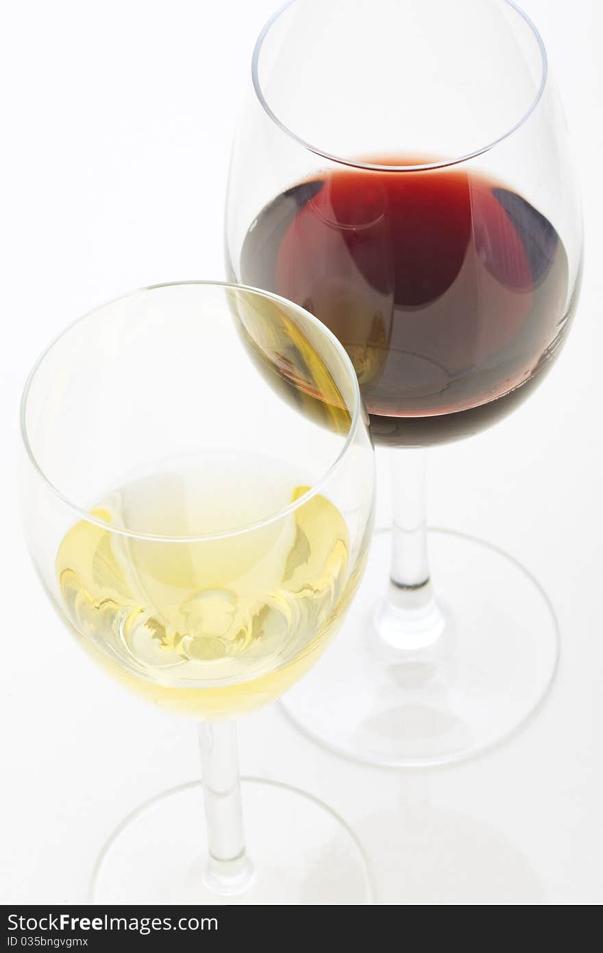 A glass of white wine and red wine isolated on white background