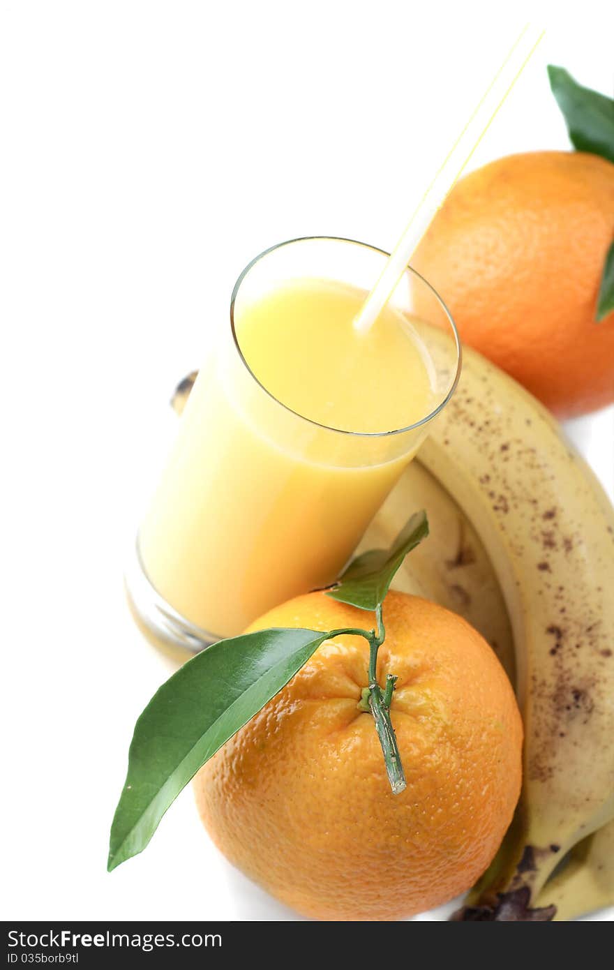 Orange and orange juice in a glass on a white background