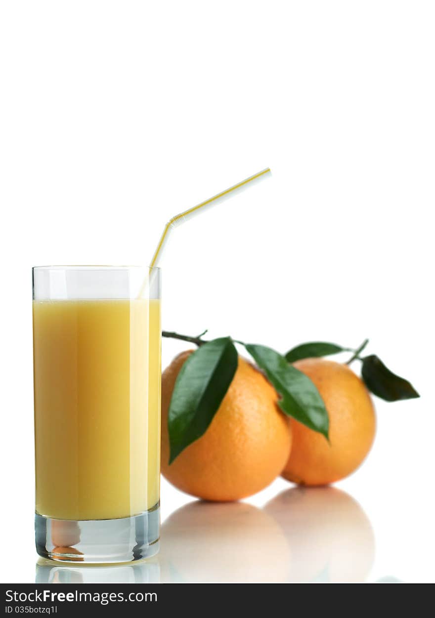 Orange and orange juice in a glass on a white background