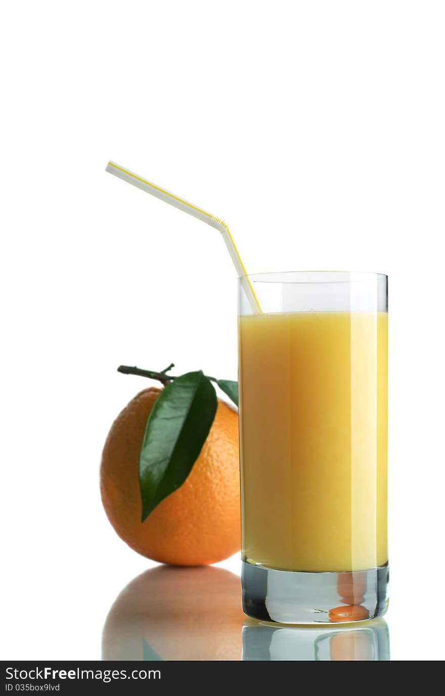 Orange and orange juice in a glass on a white background