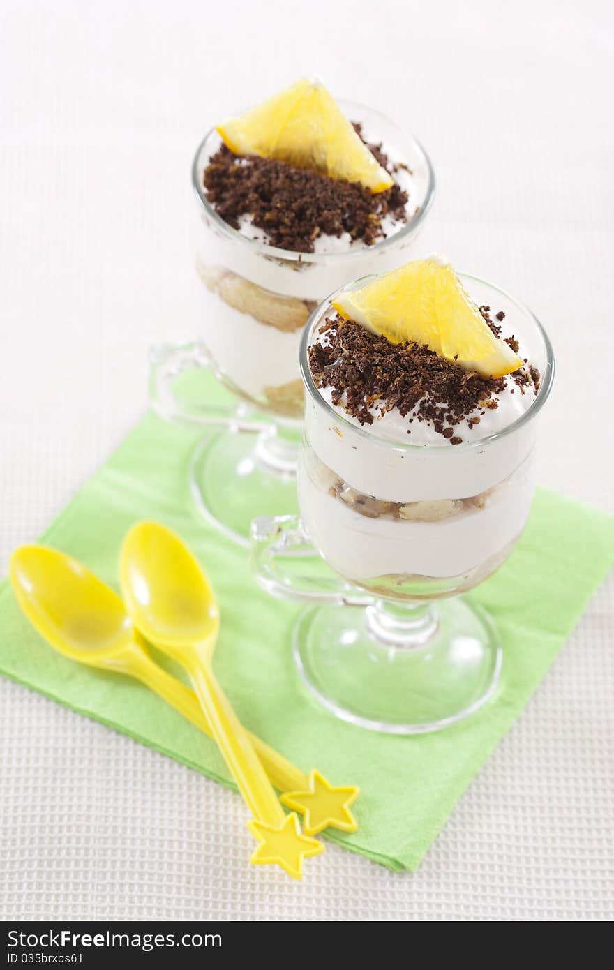 Tasty tiramisu dessert in two glasses