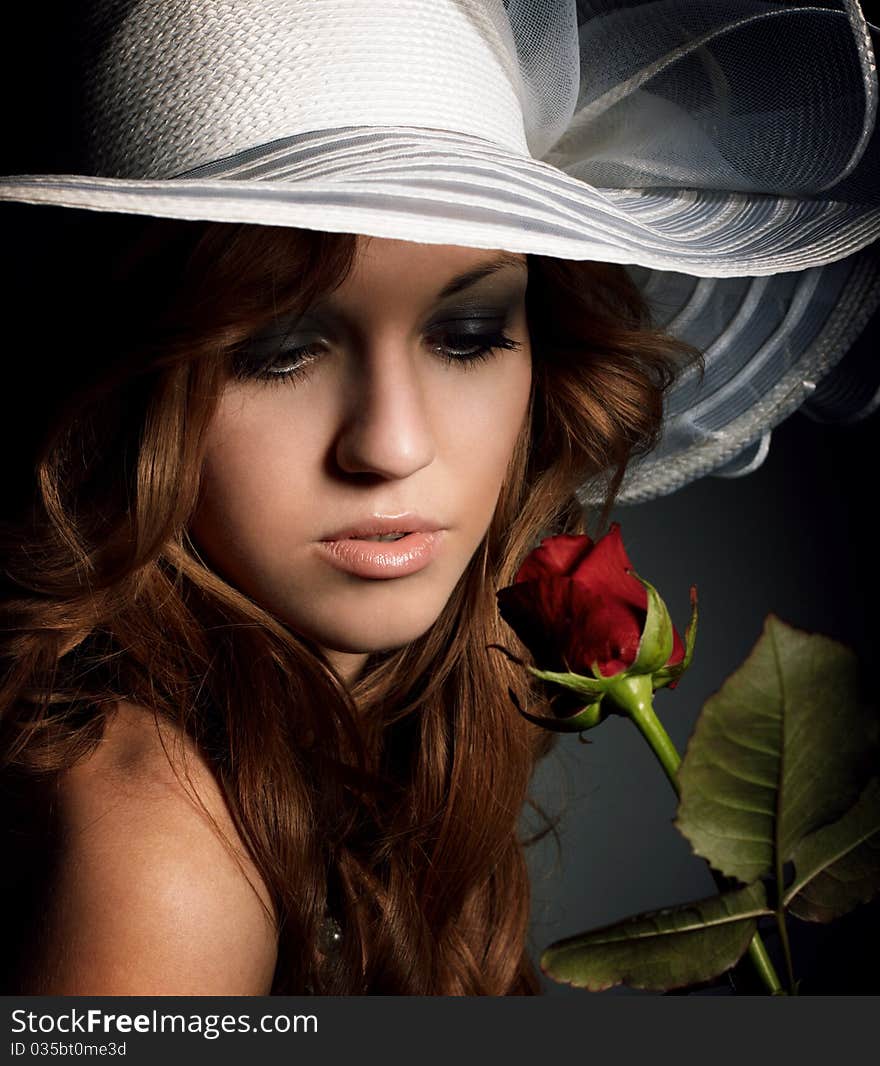 Beauty girl with red rose