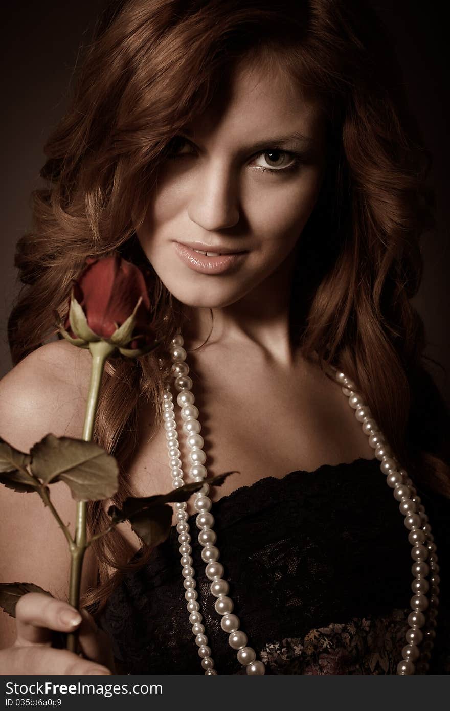 Beauty girl with red rose