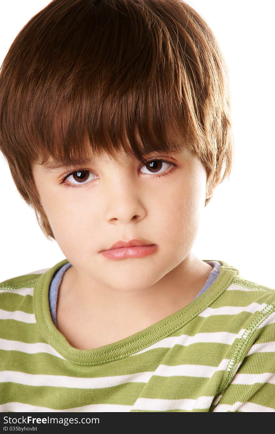 Portrait of beautiful little boy with serious look