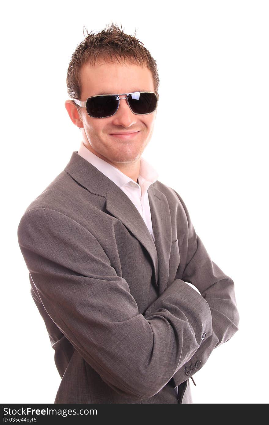 Satisfied business man with arms folded on white background. Satisfied business man with arms folded on white background