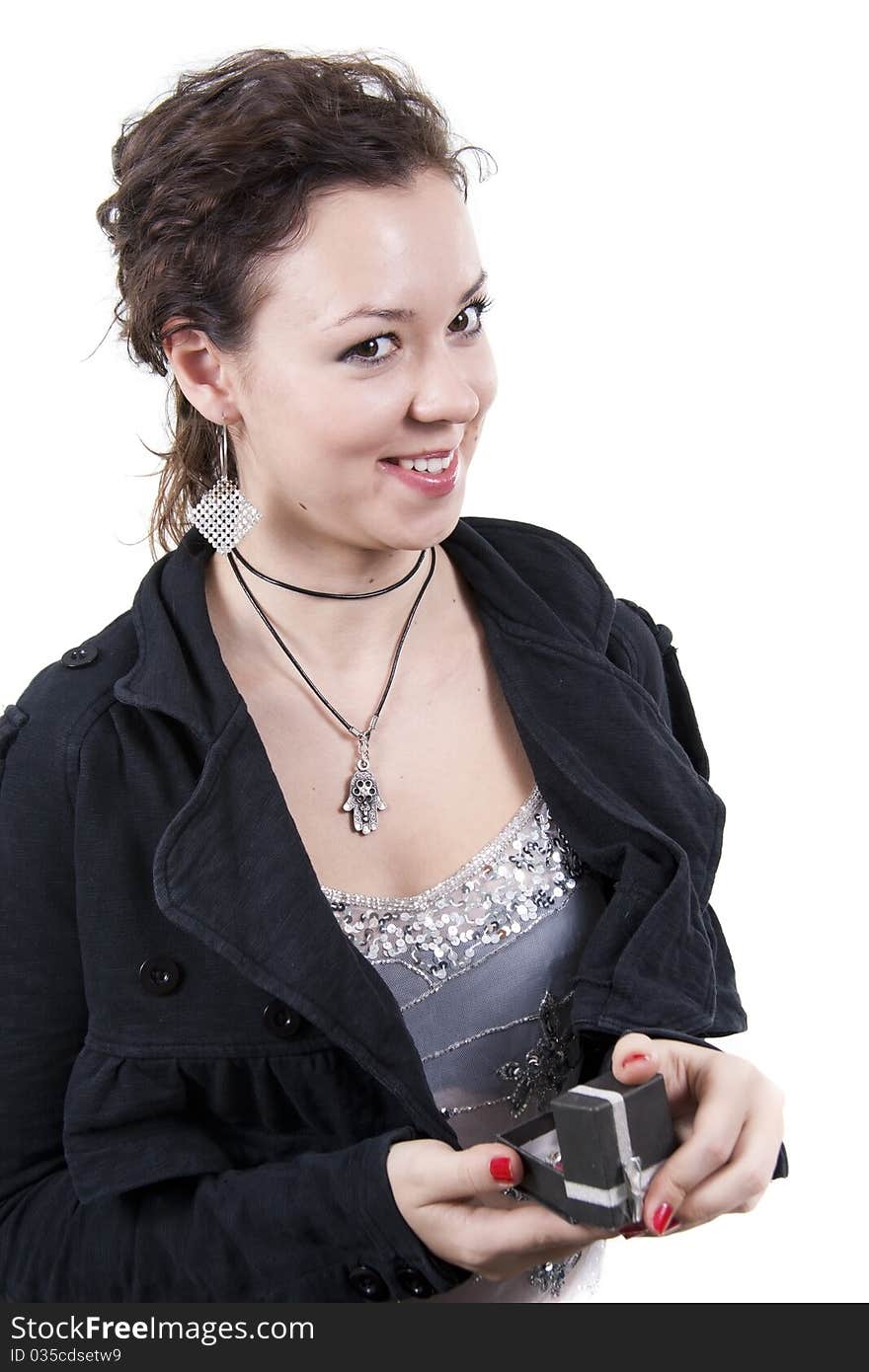 Cherfull young lady and gift on white background