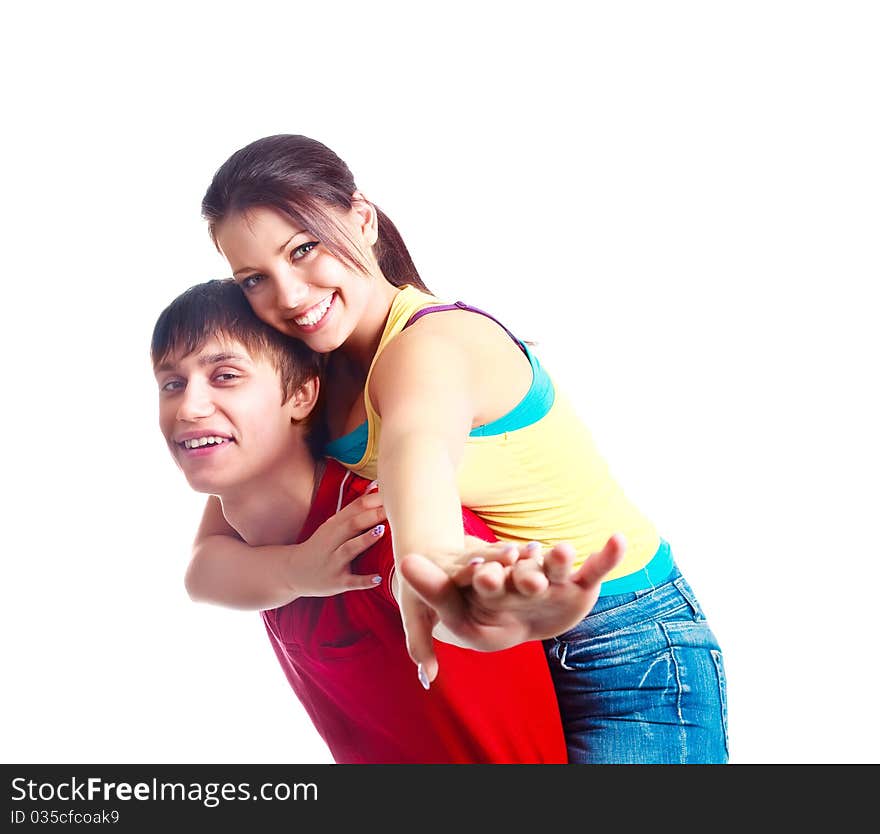 Happy excited teenage couple, a boy giving a piggyback ride to his girlfriend (focus on the girl)