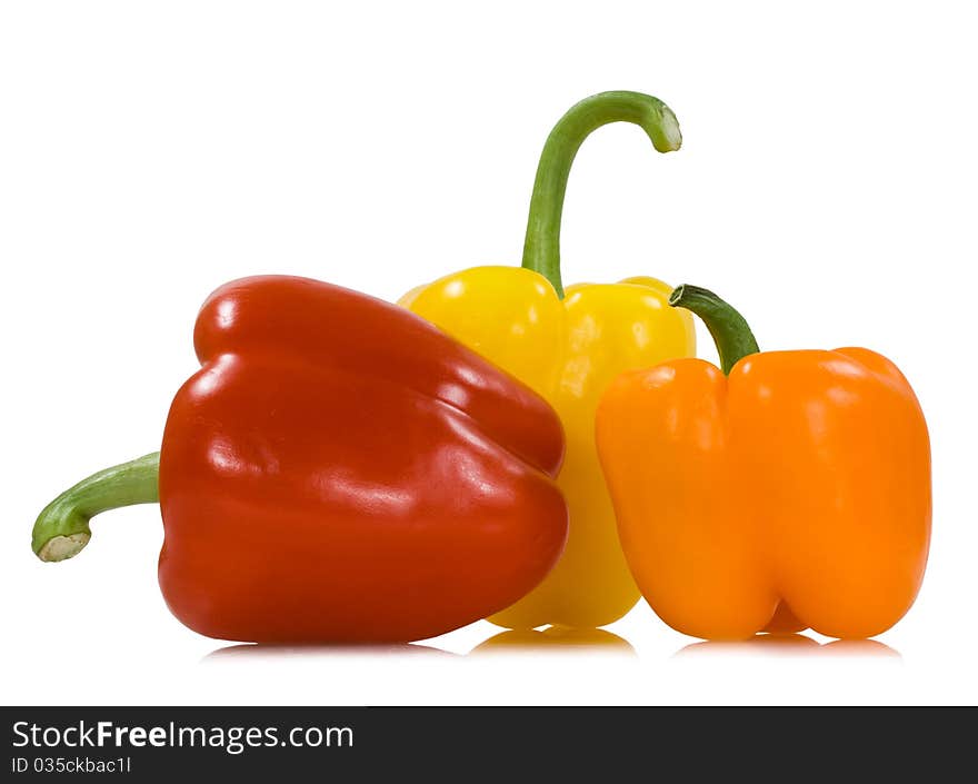 Red orange yellow peppers isolated on the white background