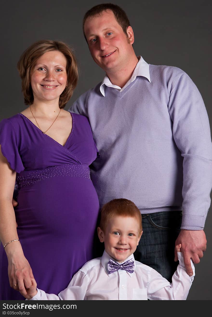 Happy Family With Cute Boy Expecting Another Baby