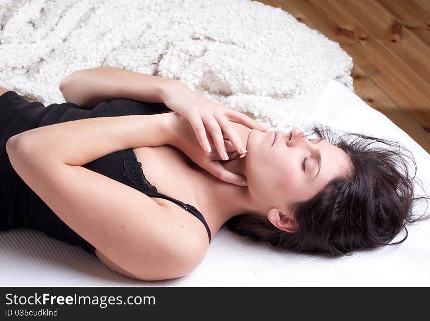 Beautiful woman lying and sleep on the snowy bed. Beautiful woman lying and sleep on the snowy bed