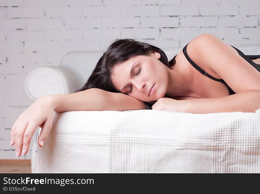 Beautiful woman lying and sleep on the snowy bed. Beautiful woman lying and sleep on the snowy bed