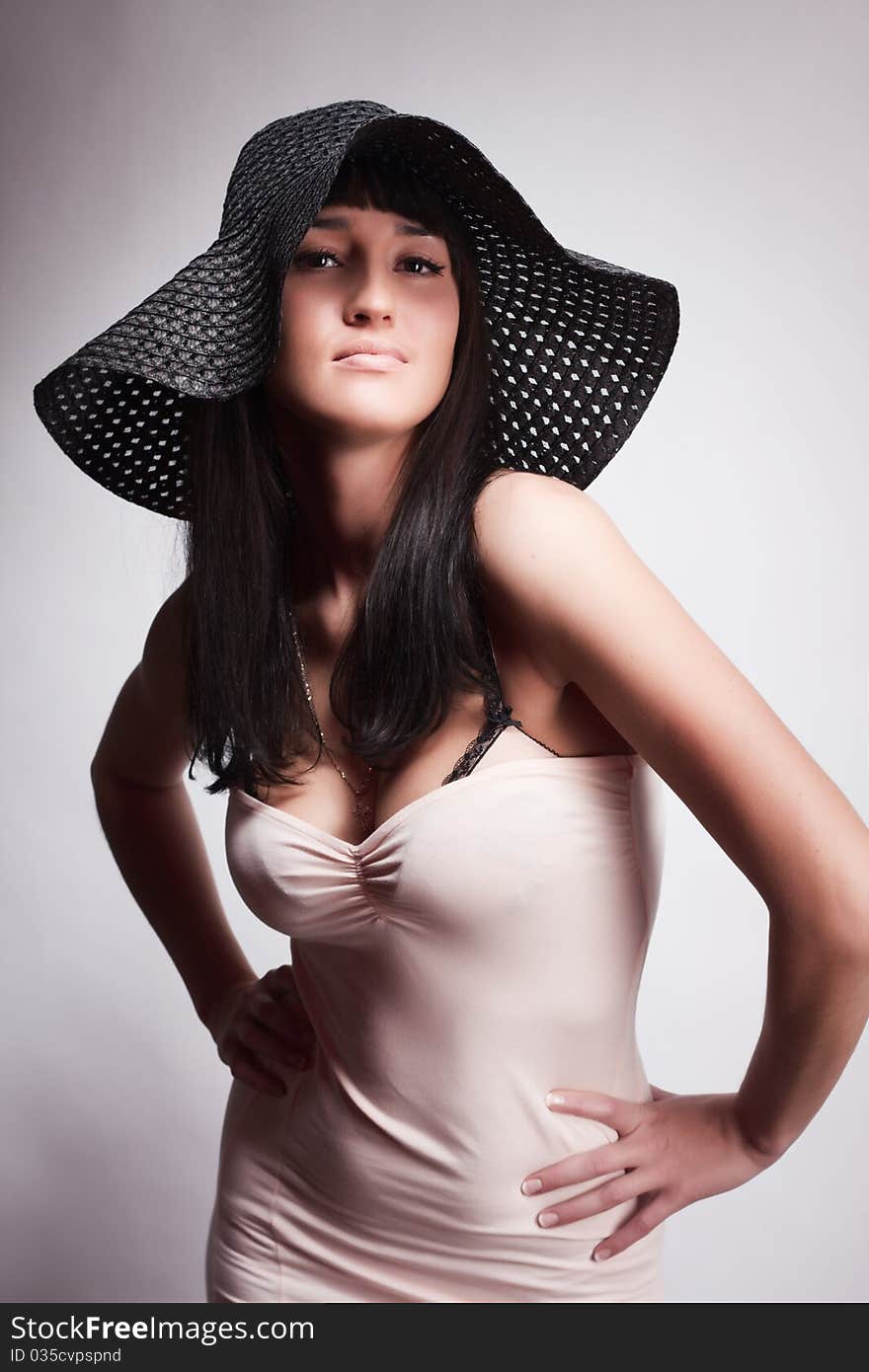 Woman posing in a hat