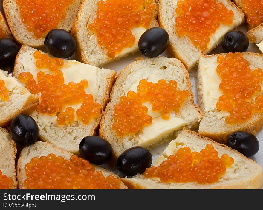 Sandwiches with red caviar, isolated on white