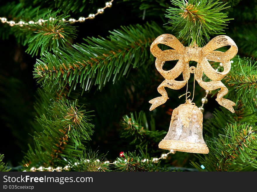 A bow with bell on chrismas tree