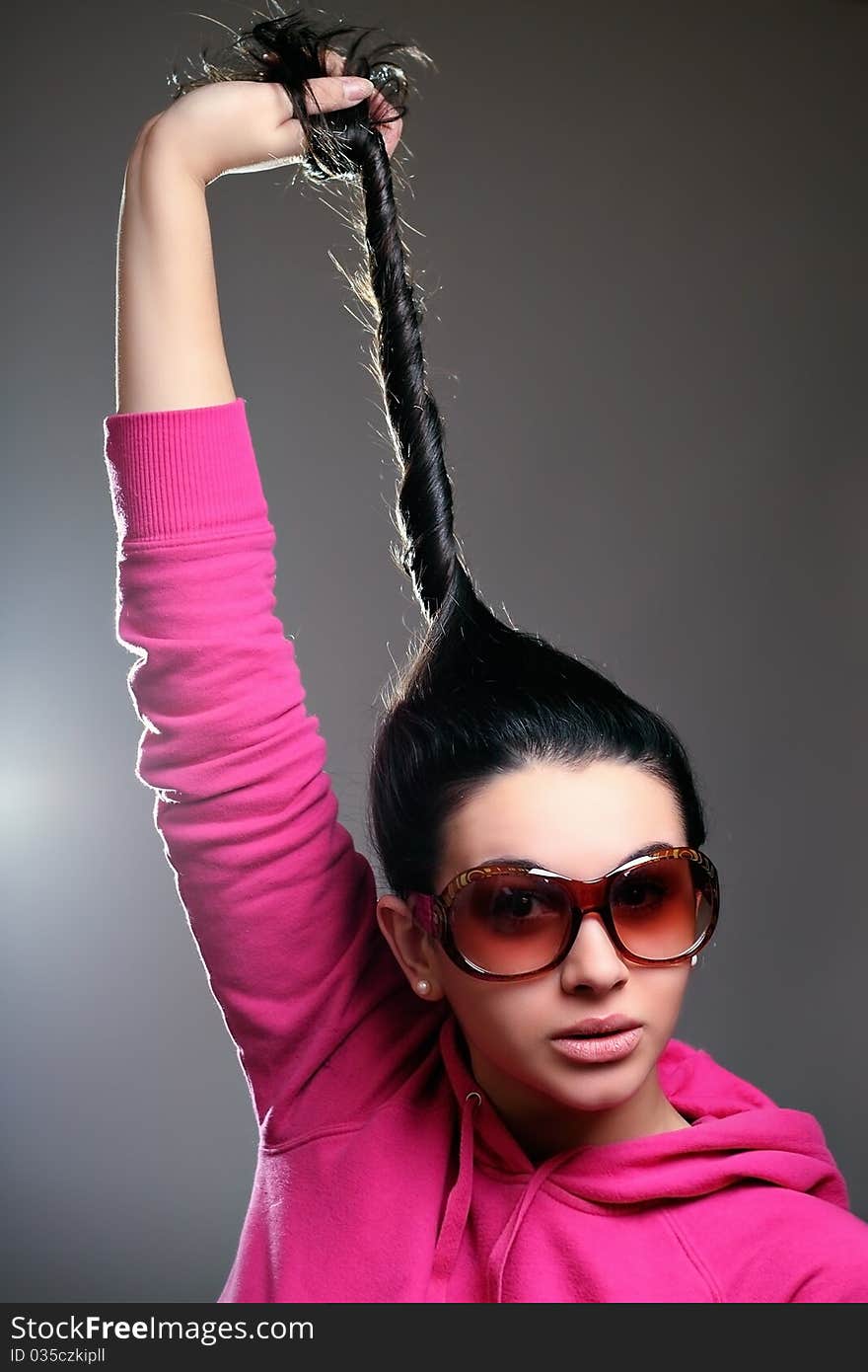 Fashion girl posing on dark background