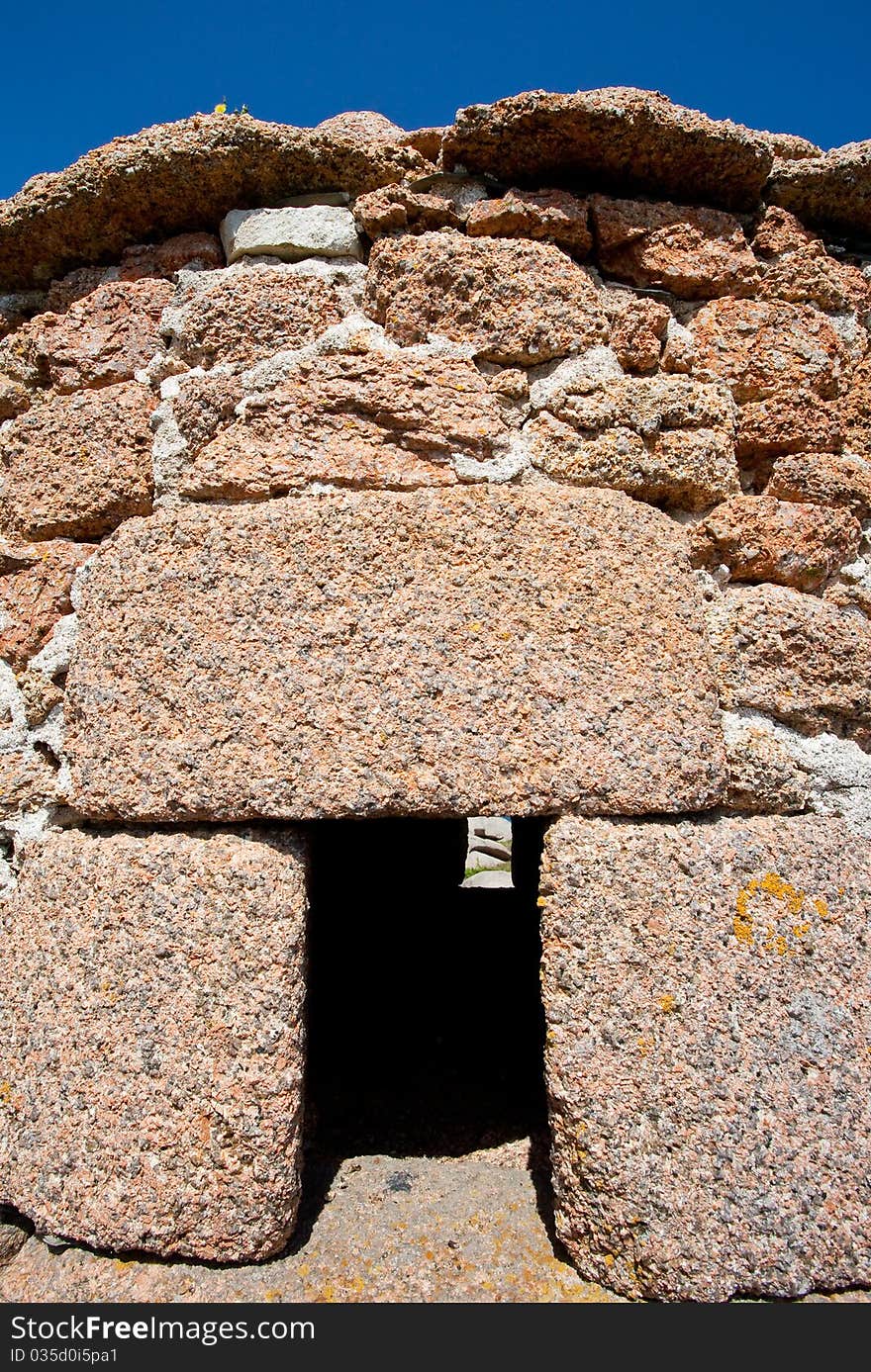 Wall of Breton shed from rose granite. Wall of Breton shed from rose granite