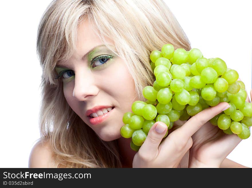 Young girl with grape