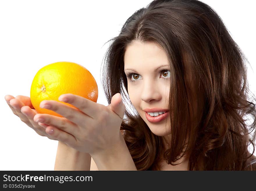 Beautiful young woman holding an orange. Close up. Beautiful young woman holding an orange. Close up