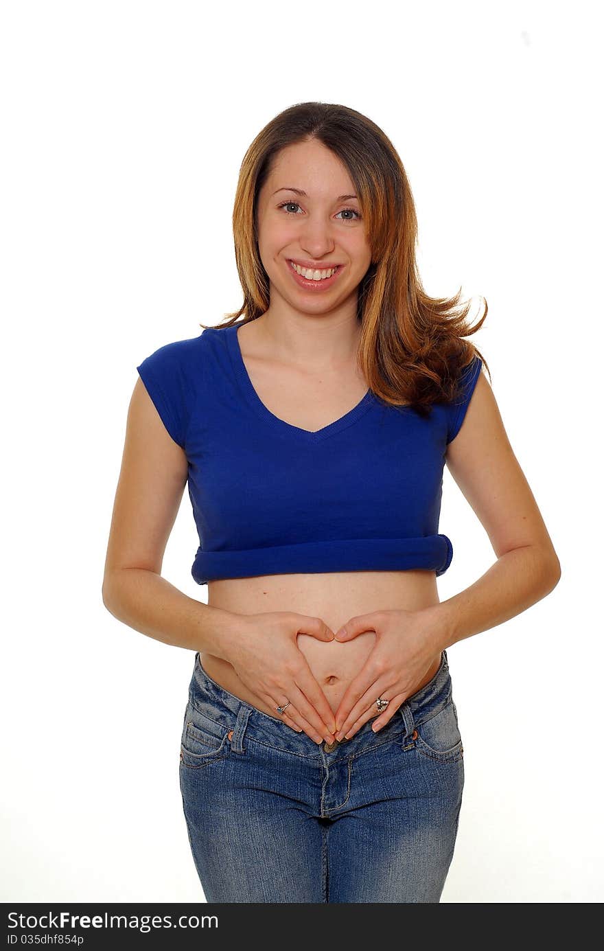 Young pregnant hispanic woman touching her small belly. Young pregnant hispanic woman touching her small belly