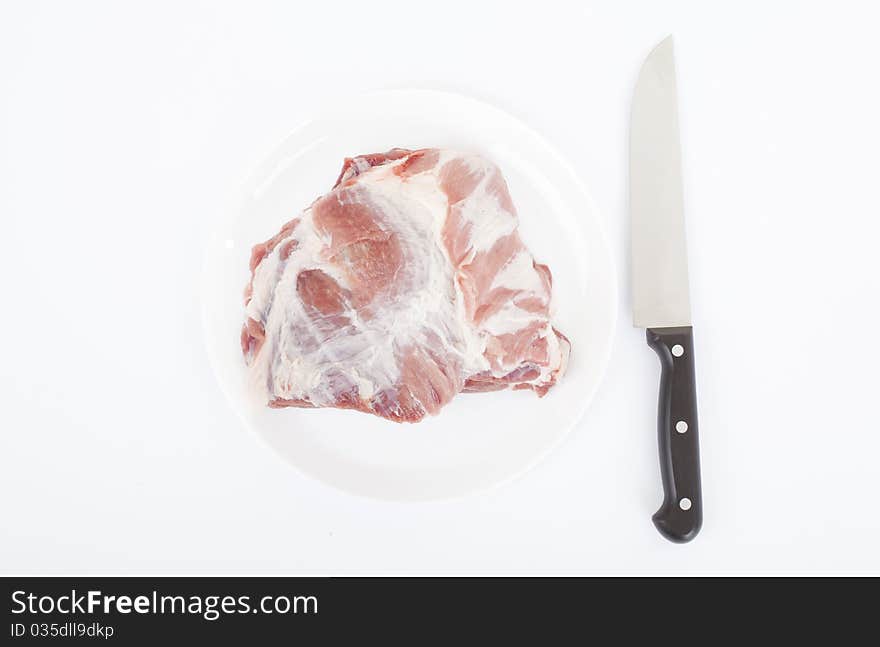 Crude meat closeup on a white backgrounds