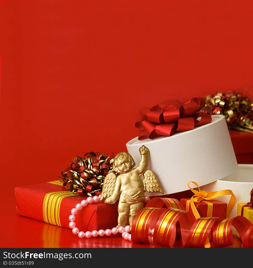 Box with a gift on a red background still life