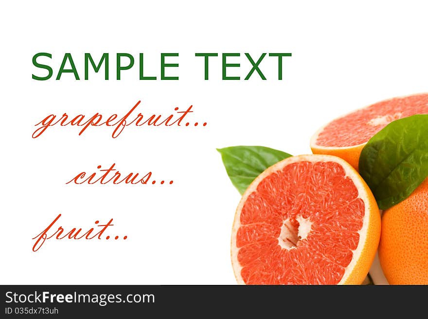 Fresh juicy grapefruits with green leafs. Isolated