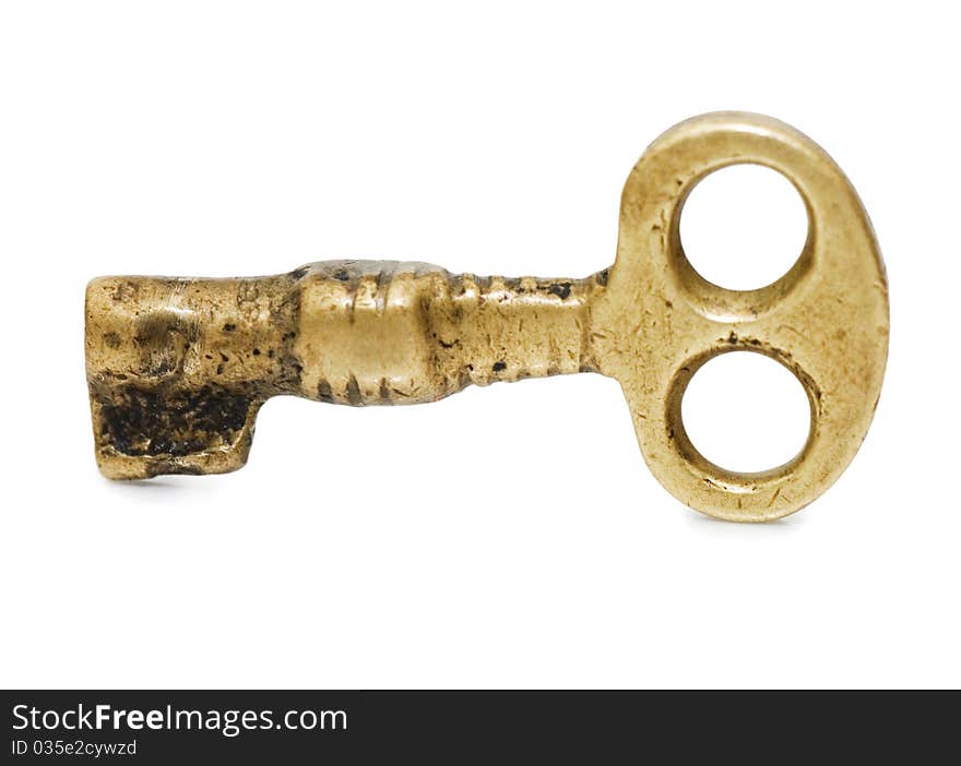 Old key on a white background close up