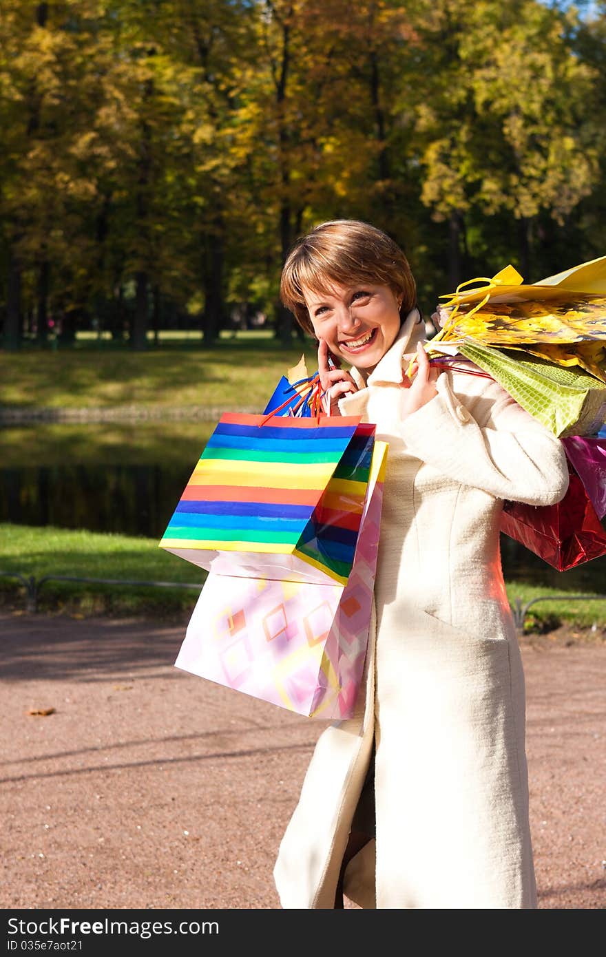 Charming young woman with purchases