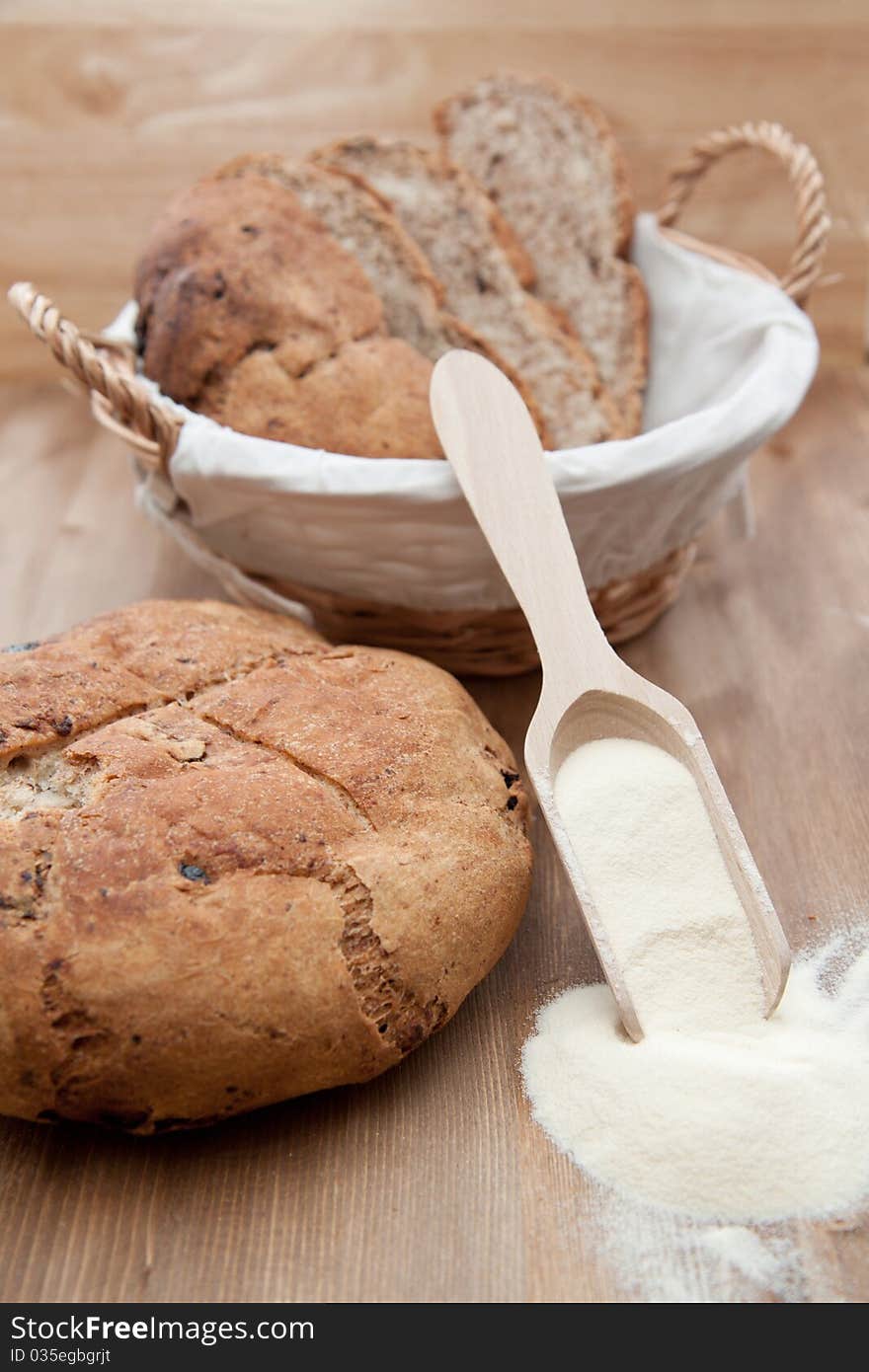 Fresh cooking sliced bread in the basket and whole bread. Fresh cooking sliced bread in the basket and whole bread